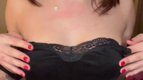 sexy milf teasing her boobies in the bedroom